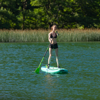 Thumbnail for an woman on a Jobe Aero Loa 11’6” Inflatable Paddle Board SUP
