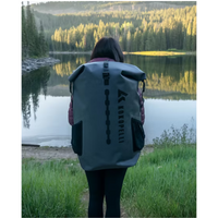Thumbnail for a person carrying Kokopelli XPD Inflatable Boat Package Granite in a bag