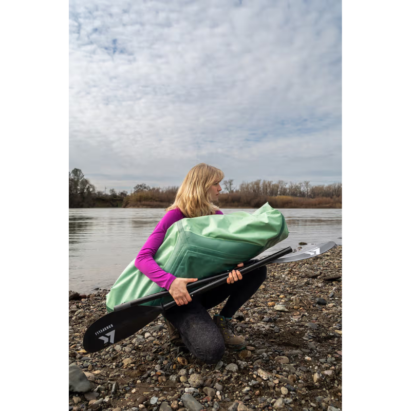 a person holding Kokopelli XPD Sage boat