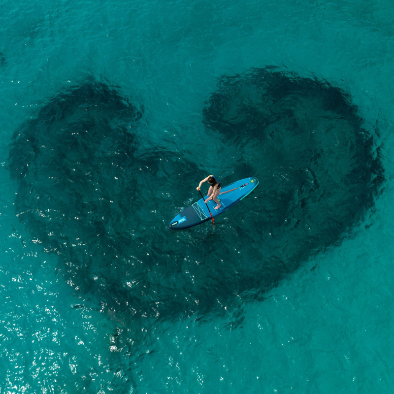 a person riding Jobe Aero Varna 11’ Inflatable Paddle Board 