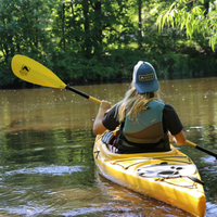 Thumbnail for a person usning Bending Branches Bounce 2pc Kayak Paddle — Yellow to row a kayak