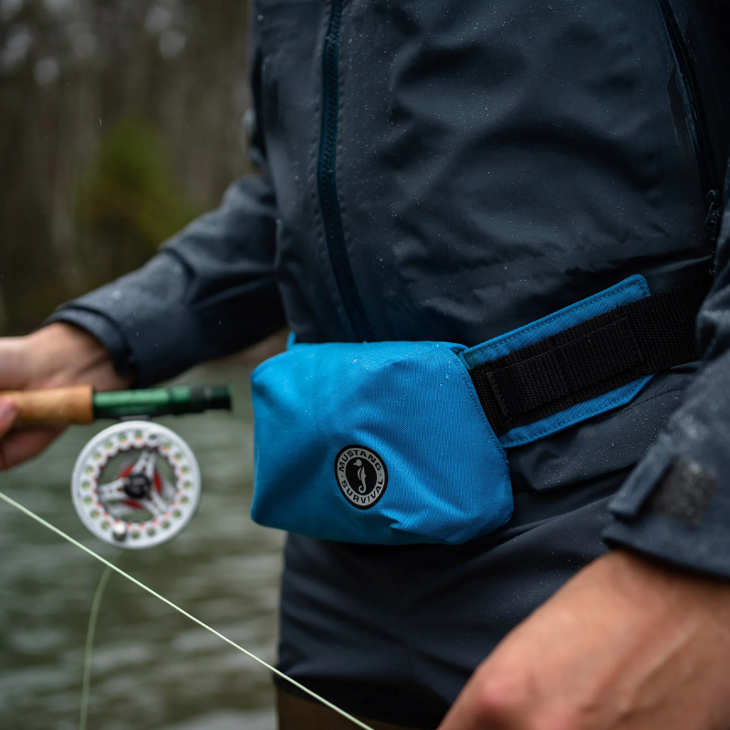 a person with Mustang Survival Minimalist Manual Inflatable Belt Pack- Azure (Blue)