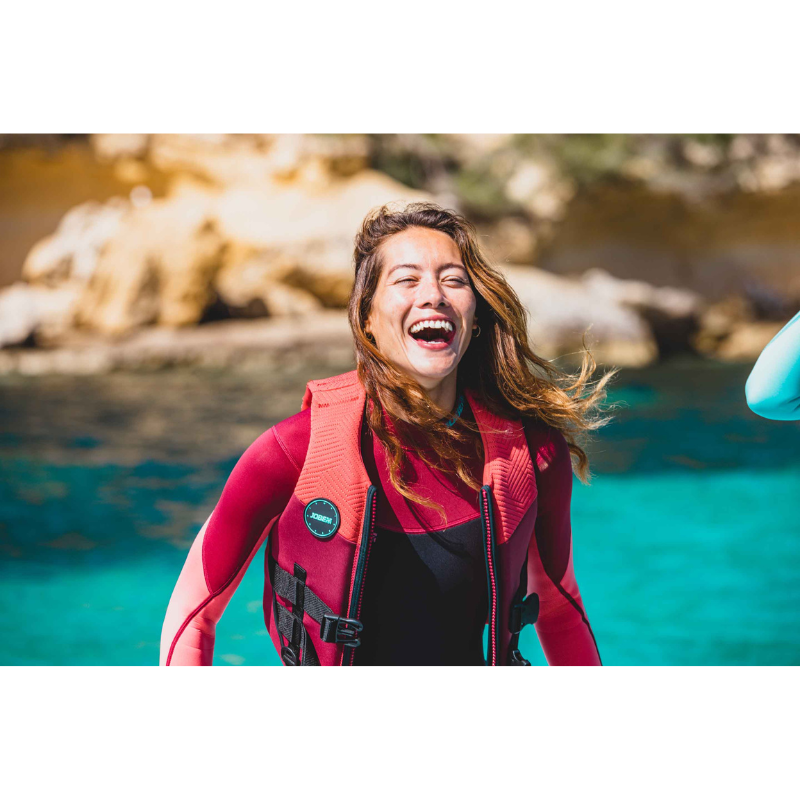 a smiling woman wearing a Jobe Sofia 3/2mm Back Zip pink Full Wetsuit Women