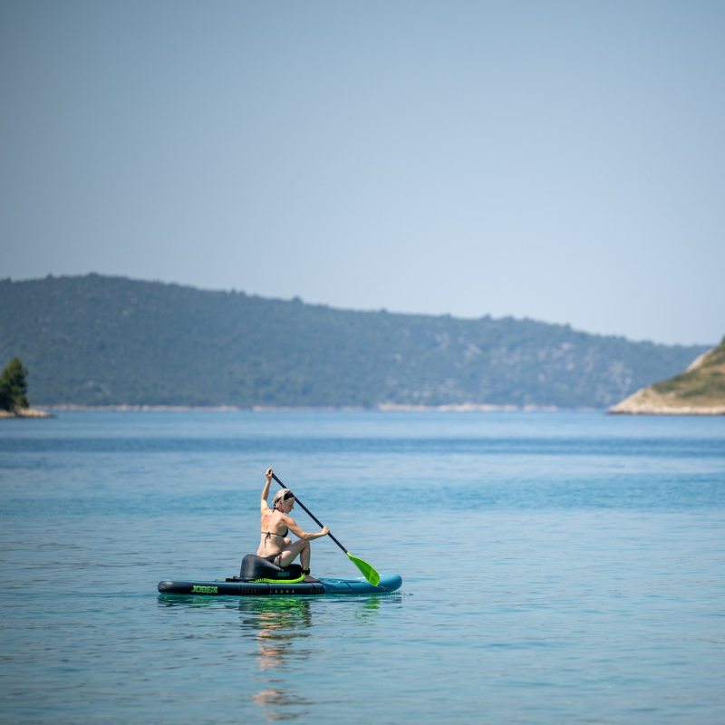 distant view of a person using Jobe Inflatable SUP Seat