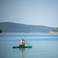 Thumbnail for distant view of a person using Jobe Inflatable SUP Seat