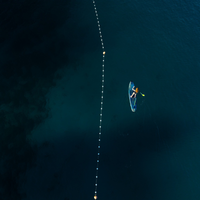 Thumbnail for overhead view of a person riding Jobe Aero Duna Inflatable Paddle Board iSUP – Blue