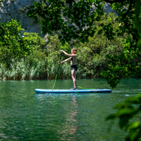 Thumbnail for side view of an woman on Jobe Aero Yarra 10’6” iSUP Steel Blue