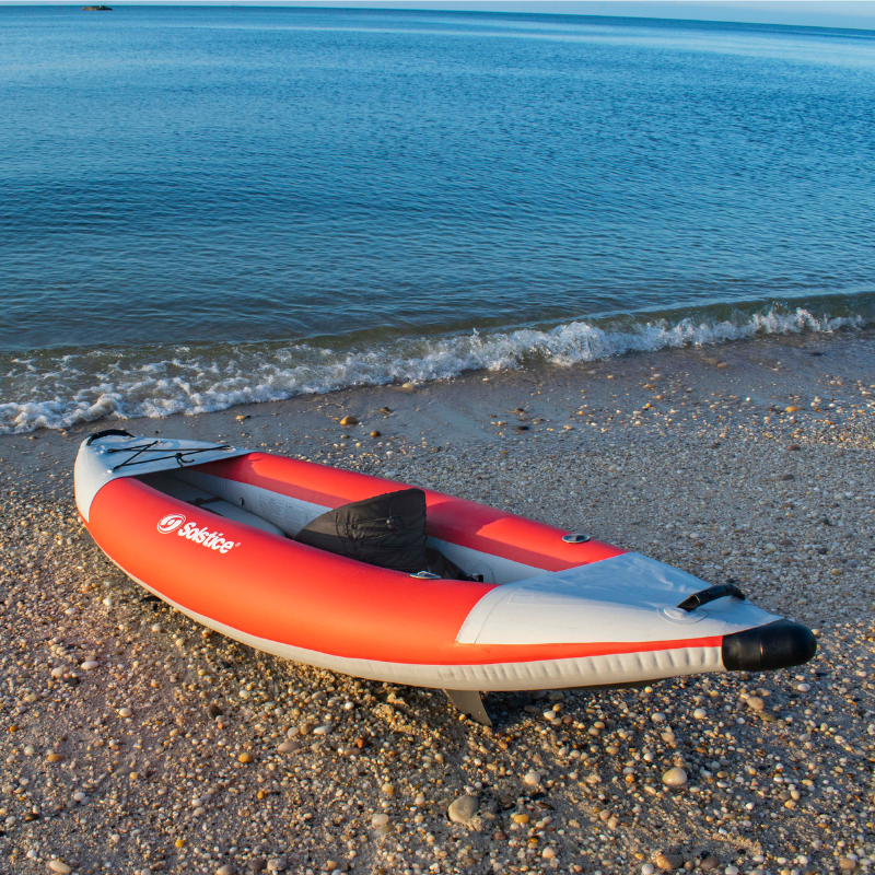 Solstice 9'6" x 35" Flare 1-person Whitewater Inflatable Kayak in the sand